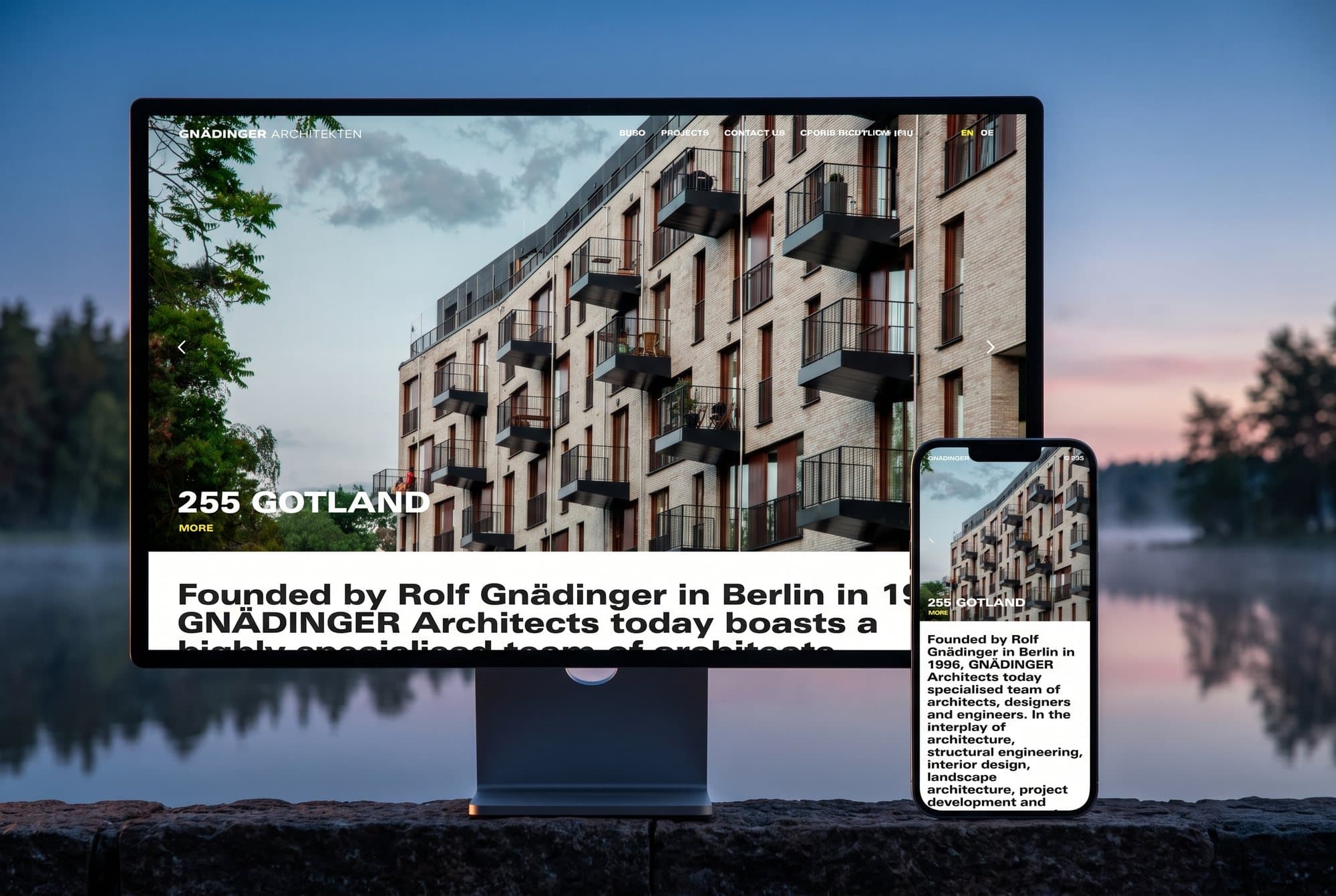 The Gnädinger Architekten website on a monitor and a phone