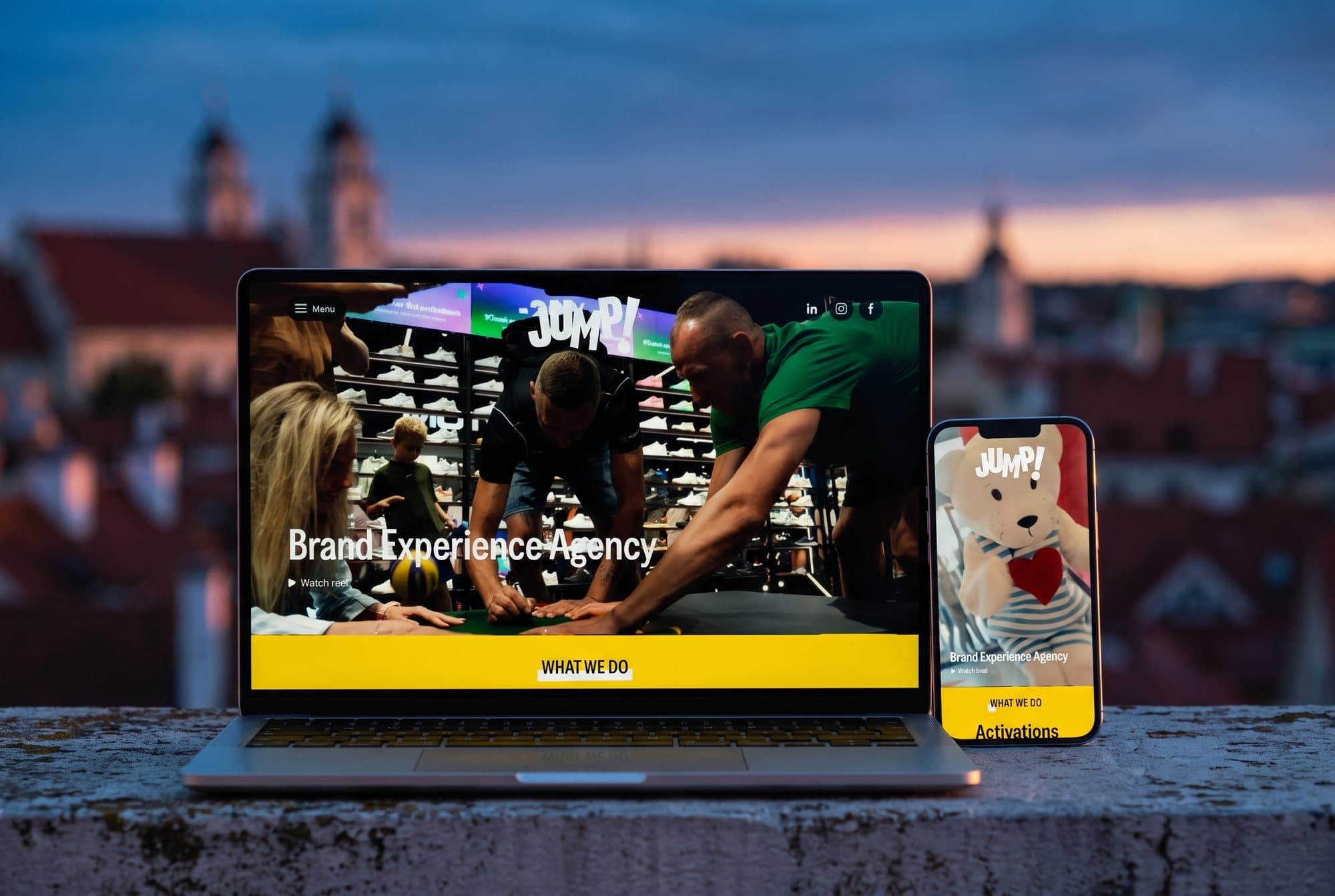 The Jump Agency website on a laptop and a phone
